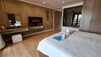 Postel nebo postele na pokoji v ubytování Elegancy Resort Hua Hin