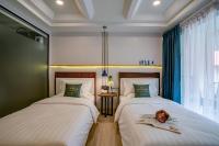 Postel nebo postele na pokoji v ubytování Momo Hotel