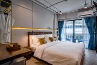 Postel nebo postele na pokoji v ubytování Momo Hotel