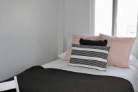 A bed or beds in a room at WISH SUITE BASILICA