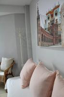 A bed or beds in a room at WISH SUITE BASILICA