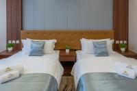 Łóżko lub łóżka w pokoju w obiekcie Willis Hotel Business & Wellness