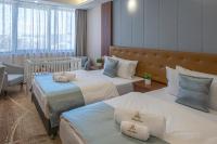 Łóżko lub łóżka w pokoju w obiekcie Willis Hotel Business & Wellness