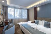 Łóżko lub łóżka w pokoju w obiekcie Willis Hotel Business & Wellness