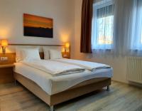 Postel nebo postele na pokoji v ubytování Maya Apartment
