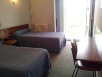 Katil atau katil-katil dalam bilik di H&ocirc;tel Sampiero Corso