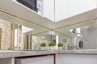 a kitchen with two sinks and a large mirror at Le Lac d&#39;Or - Duke Housing in Créteil
