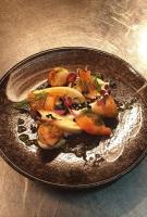 a plate of food with vegetables on a table at Ye Olde George Inn - Badger Pubs in Privett