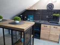 Kuchyň nebo kuchyňský kout v ubytování Apartmani Sunset