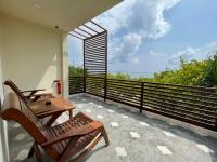 Courtyard Guesthouseにあるバルコニーまたはテラス