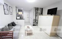 TV a/nebo společenská místnost v ubytování 243 Águila apartamentos - Estudio vista al mar - Piscina y Playa