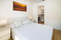 A bed or beds in a room at Bright Terrace in Milano