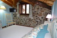 Postel nebo postele na pokoji v ubytování Casa Rural La Lastría
