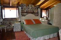 Postel nebo postele na pokoji v ubytování Casa Rural La Lastría