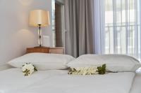 Posteľ alebo postele v izbe v ubytovaní Apartments Dmowskiego Kępa Mieszczańska by Noclegi Renters