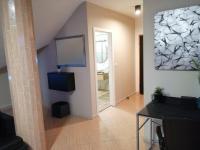 TV a/nebo společenská místnost v ubytování Apartmani Sunset