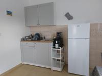 Kuchyň nebo kuchyňský kout v ubytování Apartmani Dejan