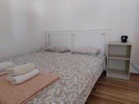 Postel nebo postele na pokoji v ubytování Apartmani Dejan