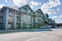 a large building on the side of a street at Silver Creek Lodge in Canmore