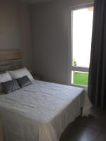 Postel nebo postele na pokoji v ubytování VivaBien Playa I - Apartamentos junto al mar