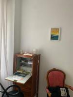 a room with a desk and a chair and a shelf at Suite&amp;Caux 1 in Cany-Barville