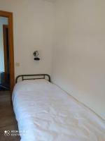 A bed or beds in a room at casa sobre rio Noguera Pallaresa