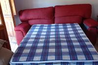 A bed or beds in a room at casa sobre rio Noguera Pallaresa
