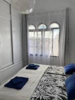 Łóżko lub łóżka w pokoju w obiekcie Fuerte Holiday M&M Apartaments