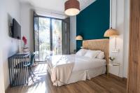 A bed or beds in a room at Casa de la Romanilla
