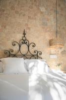 A bed or beds in a room at Casa de la Romanilla