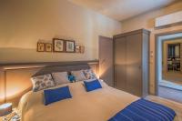Posteľ alebo postele v izbe v ubytovaní Heraclea Residential Apartments