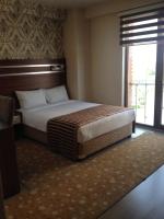 A bed or beds in a room at My Liva Hotel