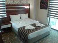 A bed or beds in a room at My Liva Hotel