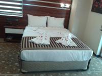 A bed or beds in a room at My Liva Hotel