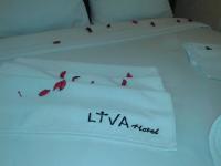 A bed or beds in a room at My Liva Hotel