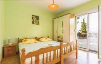 Posteľ alebo postele v izbe v ubytovaní Holiday Home Brela 55