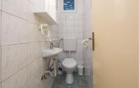 a small bathroom with a toilet and a sink at Gorgeous Apartment In Vir With House Sea View in Vir