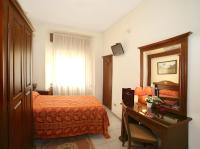 Posteľ alebo postele v izbe v ubytovaní Hotel Pavone