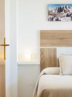 A bed or beds in a room at Cubo's La Terraza del Mar