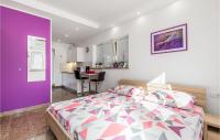 a bedroom with a bed and a purple wall at Beautiful Apartment In Rukavac With Wifi in Rukavac