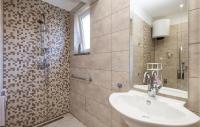 a bathroom with a sink and a shower at Beautiful Apartment In Rukavac With Wifi in Rukavac