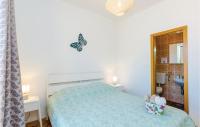 Posteľ alebo postele v izbe v ubytovaní Holiday Home Slano 45