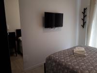 A television and/or entertainment centre at SoleLuna Fiera 6 Rooms