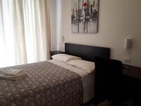 A bed or beds in a room at SoleLuna Fiera 6 Rooms