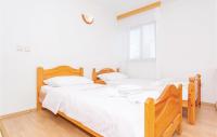 Posteľ alebo postele v izbe v ubytovaní Lovely Apartment In Malinska With Wifi