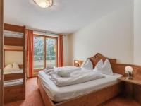 Łóżko lub łóżka w pokoju w obiekcie Chalet apartment in Saalbach-Hinterglemm