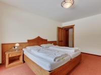 Łóżko lub łóżka w pokoju w obiekcie Chalet apartment in Saalbach-Hinterglemm