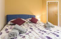Postel nebo postele na pokoji v ubytování Apartment Makarska Gradiscanskih Hrvata