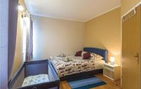 Postel nebo postele na pokoji v ubytování Apartment Makarska Gradiscanskih Hrvata