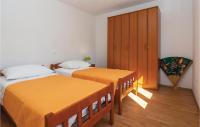 Posteľ alebo postele v izbe v ubytovaní Holiday Home Povlja With Sea View I
